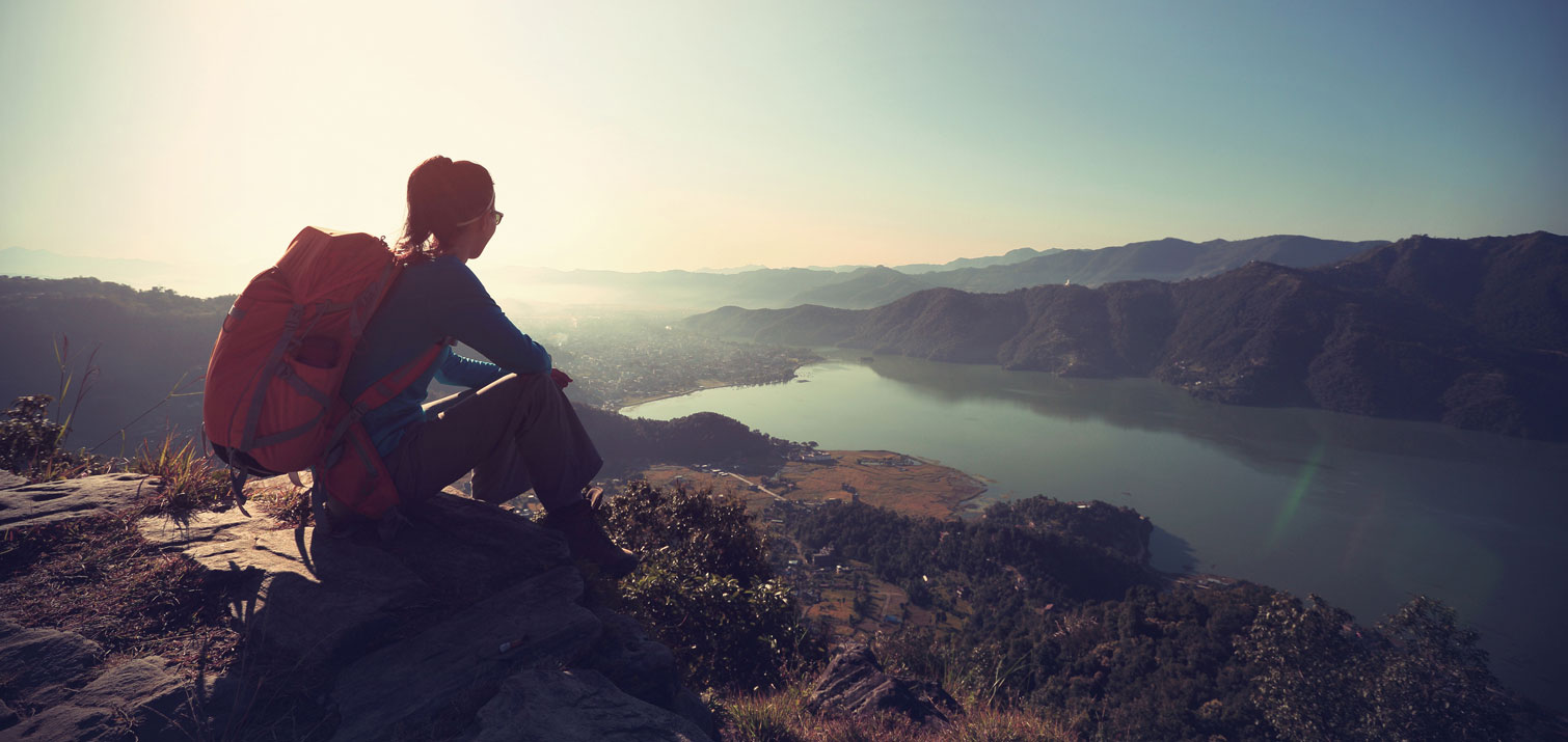 Woman sitting in the mountains